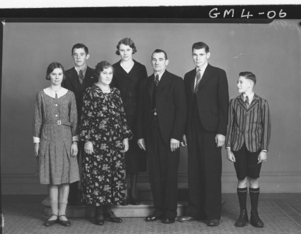 Portrait of family group man, woman and five children , F/L Johnson.