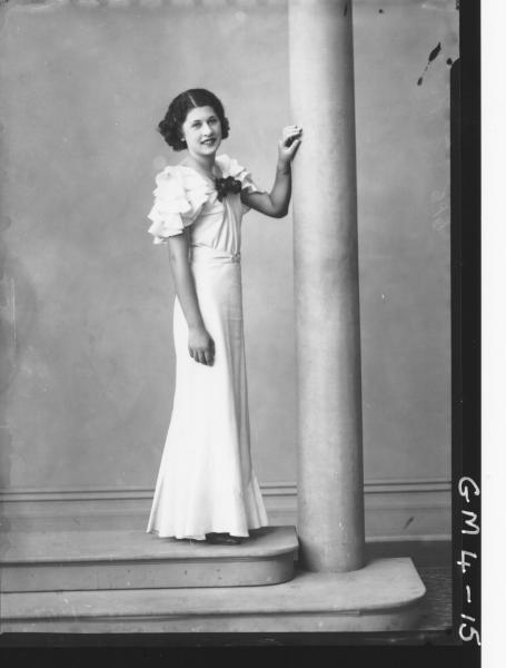 Portrait of young woman in evening dress, F/L Kent. Ivy boulder.