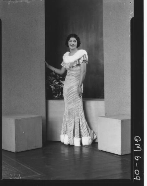 Portrait of young woman in evening dress, F/L Kruse.