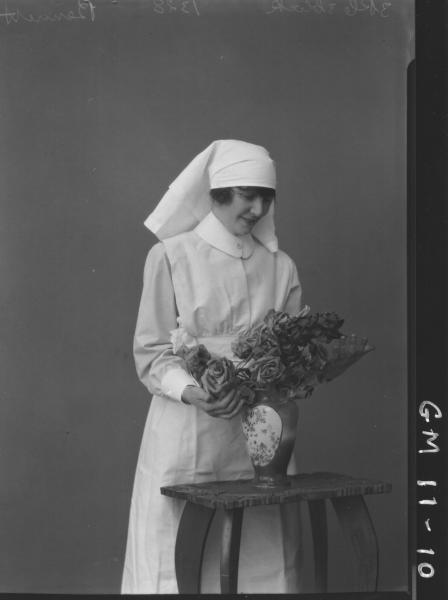 Portrait of young woman in nursing uniform,'Bennett'.