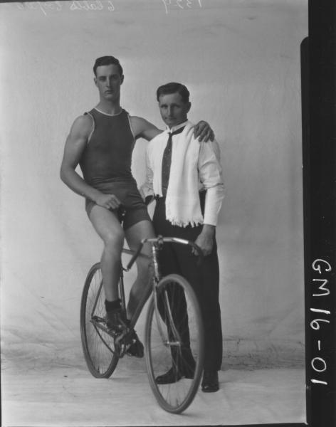 Portrait of young male bike rider, Oliver (Ted) Edward COOPER and trainer Charles Cooper, (two men not related)  Oliver Cooper was a Goldfields Champion and was deaf.  F/L.