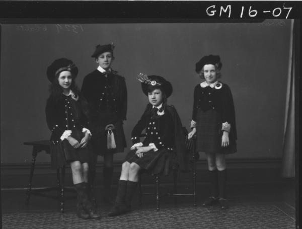 four young people in scottish costume F/L, 'Brown' and 'Mills'