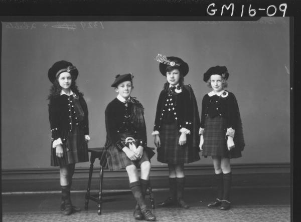 portrait of four young people in scottish national dress F/L'Brown' and 'Mills'