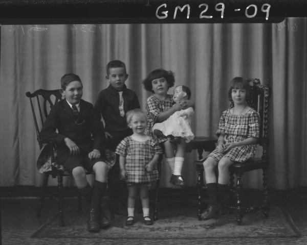portrait of family, two boys and three girls, one holding large china doll, F/L O'Brien