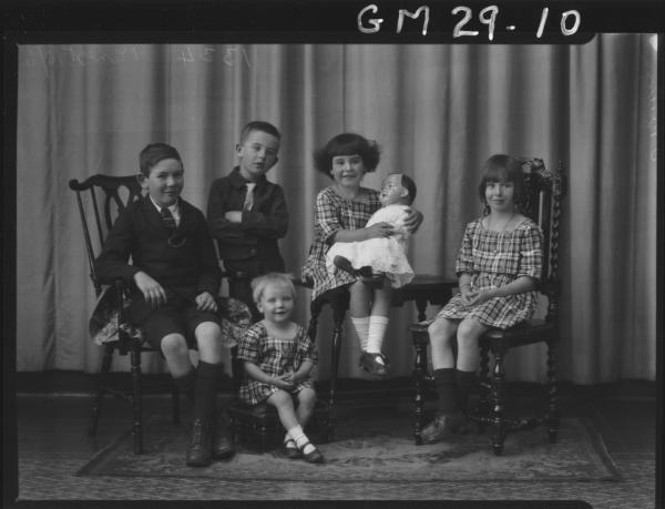 portrait of family, two boys and three girls, one holding large china doll, F/L O'Brien