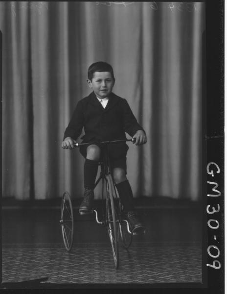 portrait of young boy riding tricycle, F/L Pysing