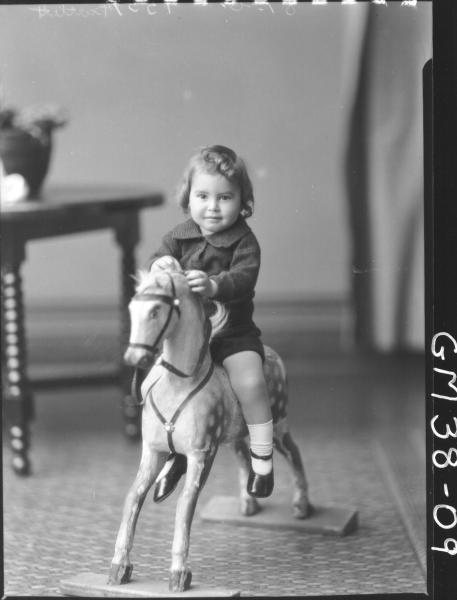 portrait of child on rocking horse, F/L Bartlett