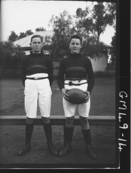 two boys footballers on pitch