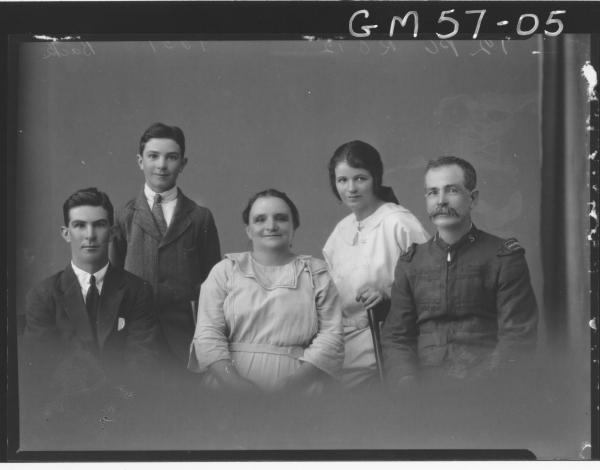 Portrait of woman, man in Salvation Army uniform and three children back