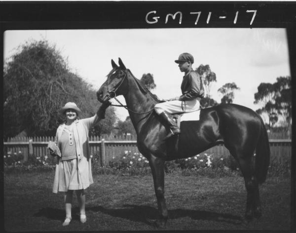 Woman holding race horse with jockey. H.E.Vail (commissioned?) 'Runabout' - Winner Kalgoorlie Cup, 1928 and 1929