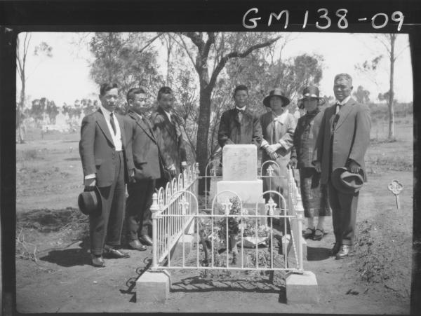 Japanese grave and mourners