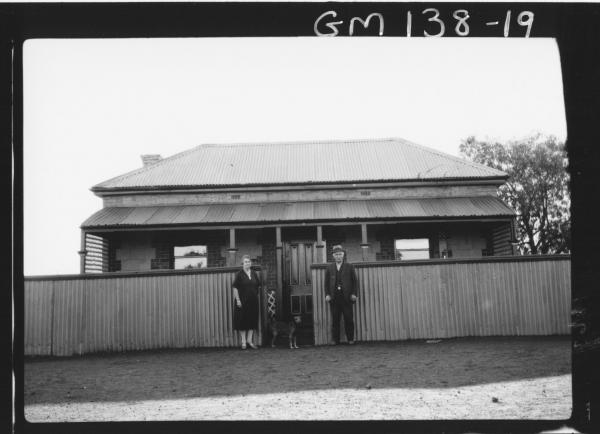 Man and woman outside house 'Martin'