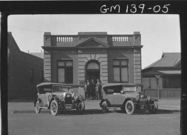 Men and cars outside Goode Durrant Office