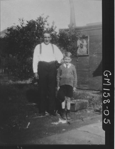 Portrait of man and child in garden 'Batten'