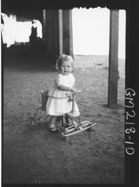 Portrait of child in shed 'Meade'