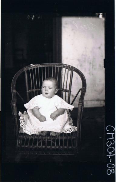 F/L Portrait of baby seated on chair wearing lace dress; 'Steel'