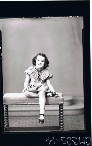 F/L Portrait of girl seated, wearing short dress with pleats and pleated collar; 'Mun?ard P. C.'