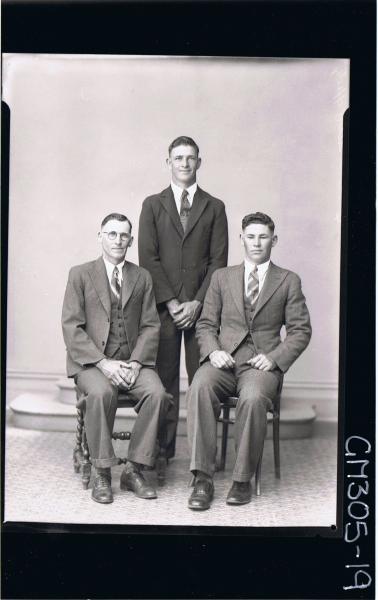 F/L Group Portrait of two men seated wearing three piece suits, one man standing; 'McCaffertey'