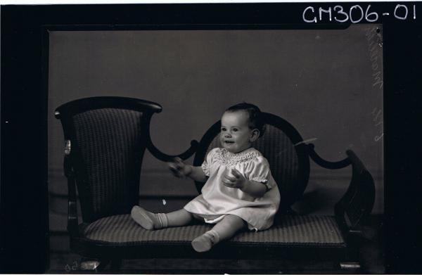 F/L Portrait of baby seated, wearing short dress; 'Marelich'