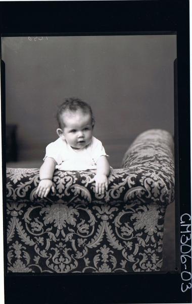 F/L Portrait of baby looking over back of couch; 'Morey'
