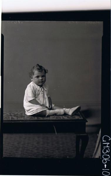 F/L Portrait of baby seated wearing short dress; 'MacFarlane'