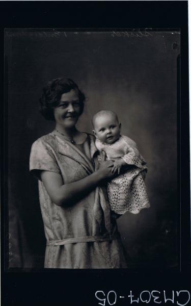 1/2 Portrait of woman standing holding baby; 'Schliker'