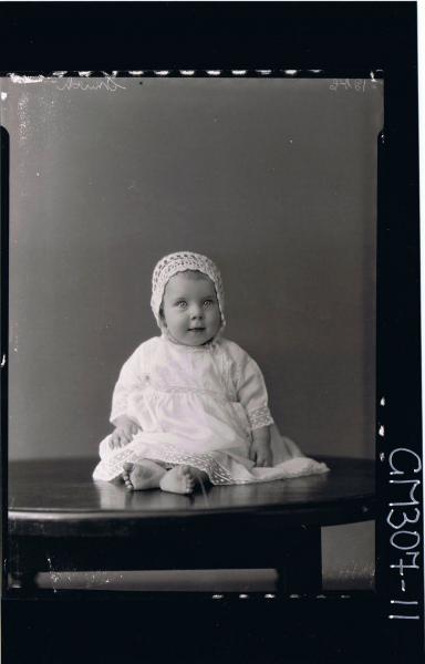 F/L Portrait of baby seated on table wearing a long lace dress and bonnet; 'Smith'