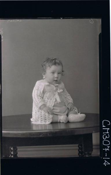 F/L Portrait of baby seated on table wearing cardigan, booties; 'Stuber'