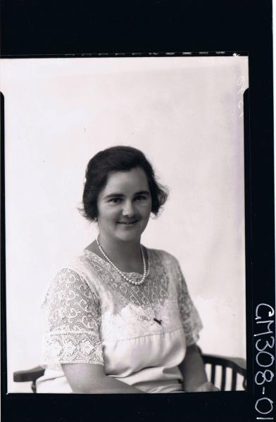 1/2 Portrait of woman seated, wearing lace dress, string of pearls, 'Springfield'