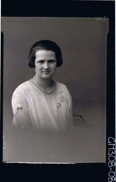 H/S Portrait of woman wearing pearls, and dresswith embroidery on one shoulder; 'Sansum'