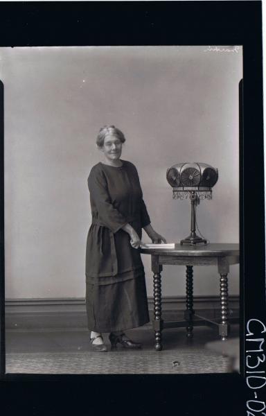 F/L Portrait of elderly woman standing wearing a long dress; 'Martin'