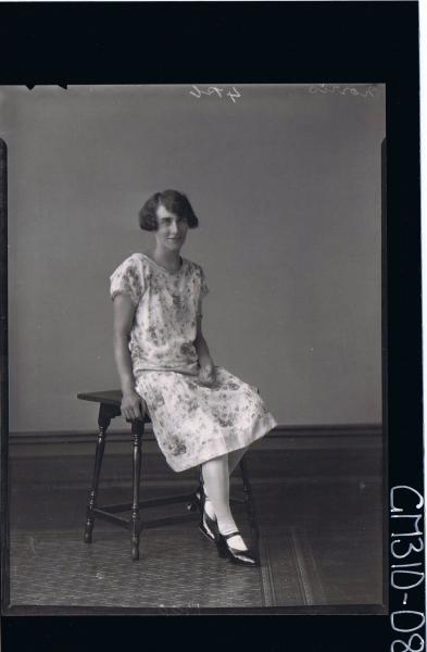 F/L Portrait of woman wearing floral day dress; 'Morris'