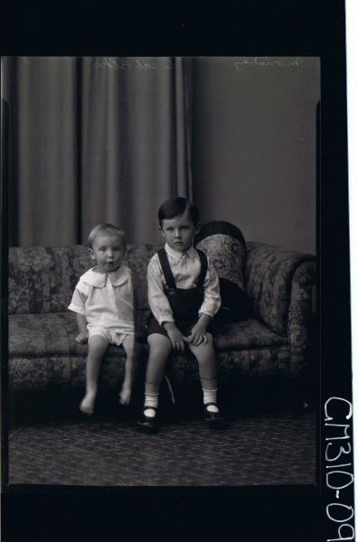 F/L Portrait of boy seated wearing shorts, shirt, child seated wearing pilchers, shirt, 'Moriarty'