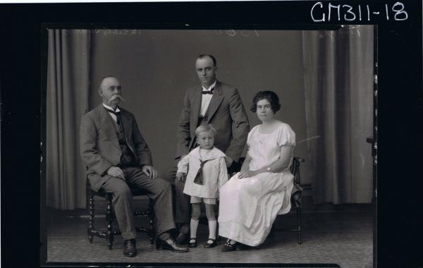 F/L Group Portrait of elderly man, and young man seated, woman seated,small boy standing wearing shirt, shorts 'Sanders'