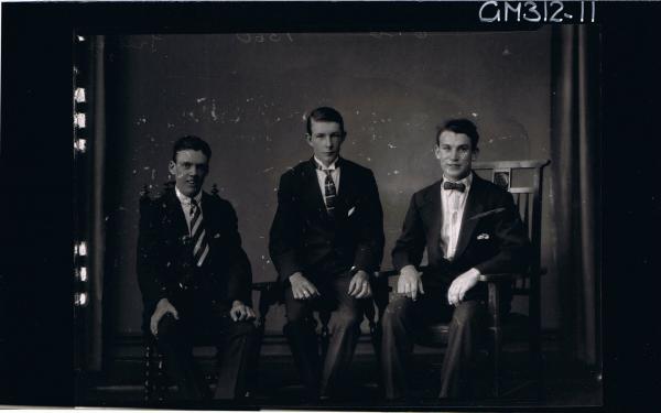 3/4 Portrait of 3 young men seated wearing suits, one man wearing bow tie 'Treloar'