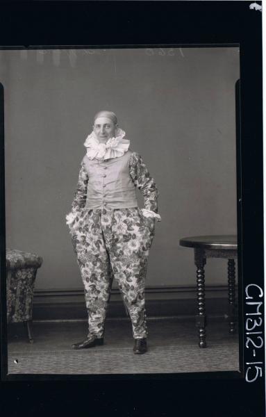 F/L Portrait of man standing, wearing clown fancy dress costume 'Shepperd'