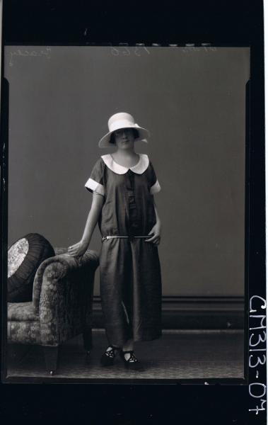 F/L Portrait of woman standing wearing ankle length dress and hat 'Tracey'