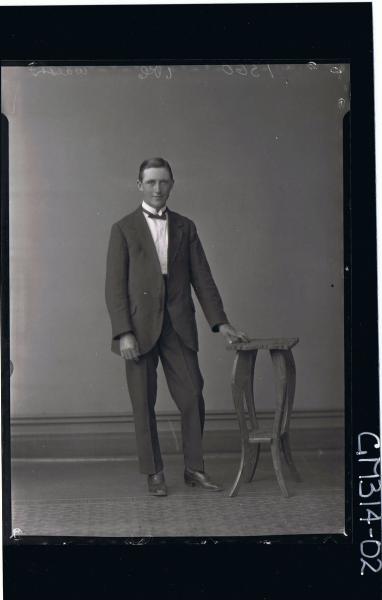 F/L Portrait of man standing wearing suit 'Walsh'