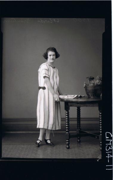 F/L Portrait of woman standing wearing three quarter length striped day dress 'Trantrum'