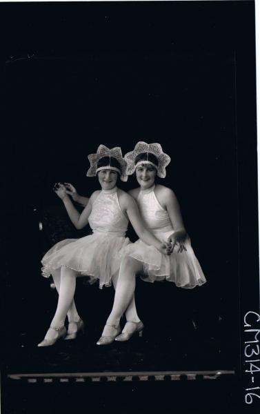 F/L Portrait of two women seated, wearing fancy dress costumes  'McCahon'