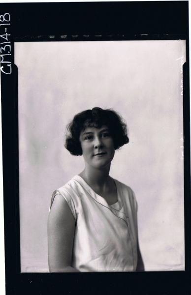 1/2 Portrait of woman seated wearing day dress 'MacKay'