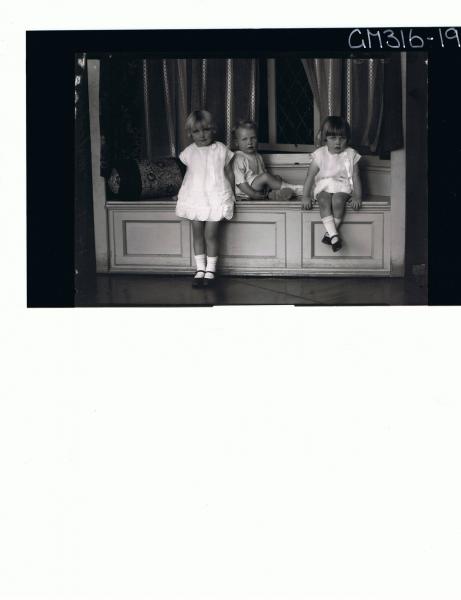 F/L Portrait of 3 children, girl standing wearing short dress,girl seated wearing short dress, boy seated 'Mulcahy'