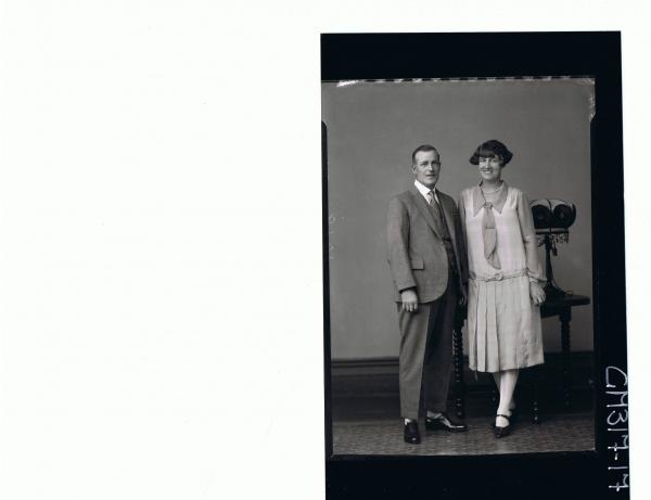 F/L Portrait of man standing wearing three piece suit, woman standing, wearing 3/4 length dress; 'Morrow'
