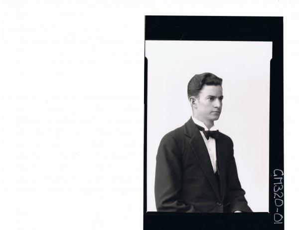 1/2 Portrait of young man wearing three piece suit, bow tie, side view; 'Stahl'