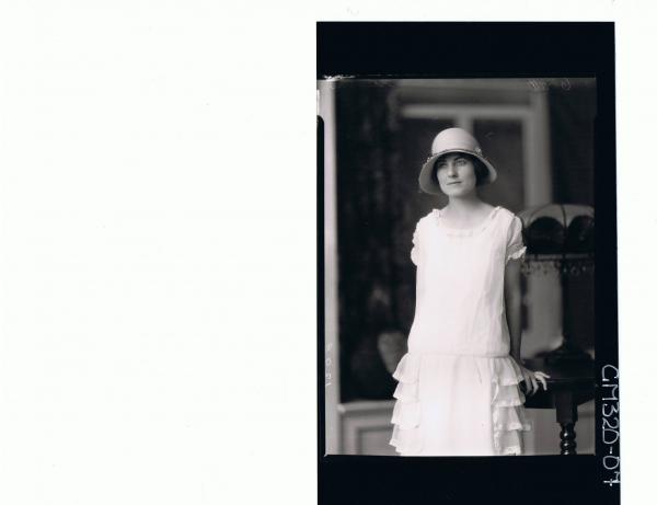 1/2 Portrait of woman standing wearing lace dress, hat 'Stevens'