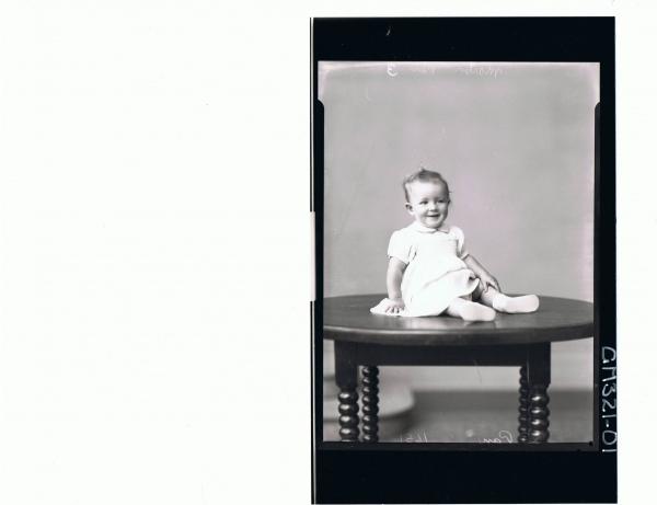 F/L Portrait of baby seated on table, wearing dress; 'Martin'