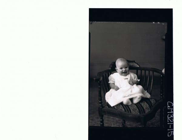 F/L Portrait of baby seated wearing dress; 'Madill'
