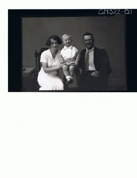 1/2 Portrait of man seated wearing suit, woman seated, boy child seated wearing shorts and shirt; 'McQuid'