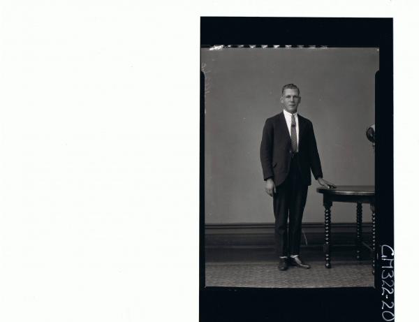 F/L Portrait of young man standing wearing suit; 'Trembath'