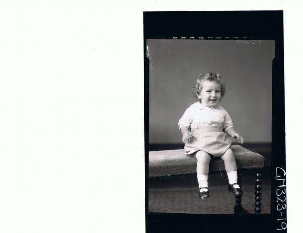 F/L Portrait of baby seated wearing shorts and shirt; 'Smith'